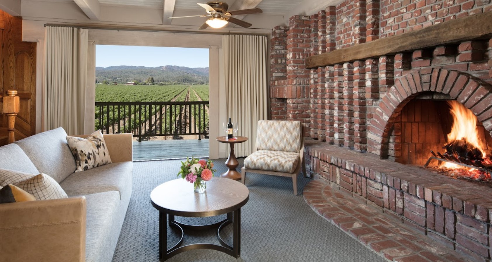 Indoor decor and open view of the vinyards from the living room of an apartment in Harvest Inn