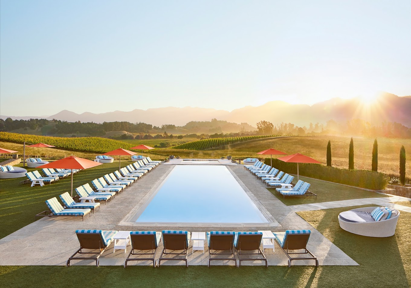 Panoramic image of a pool surrounded by vineyard's of Carneros Resort and Spa