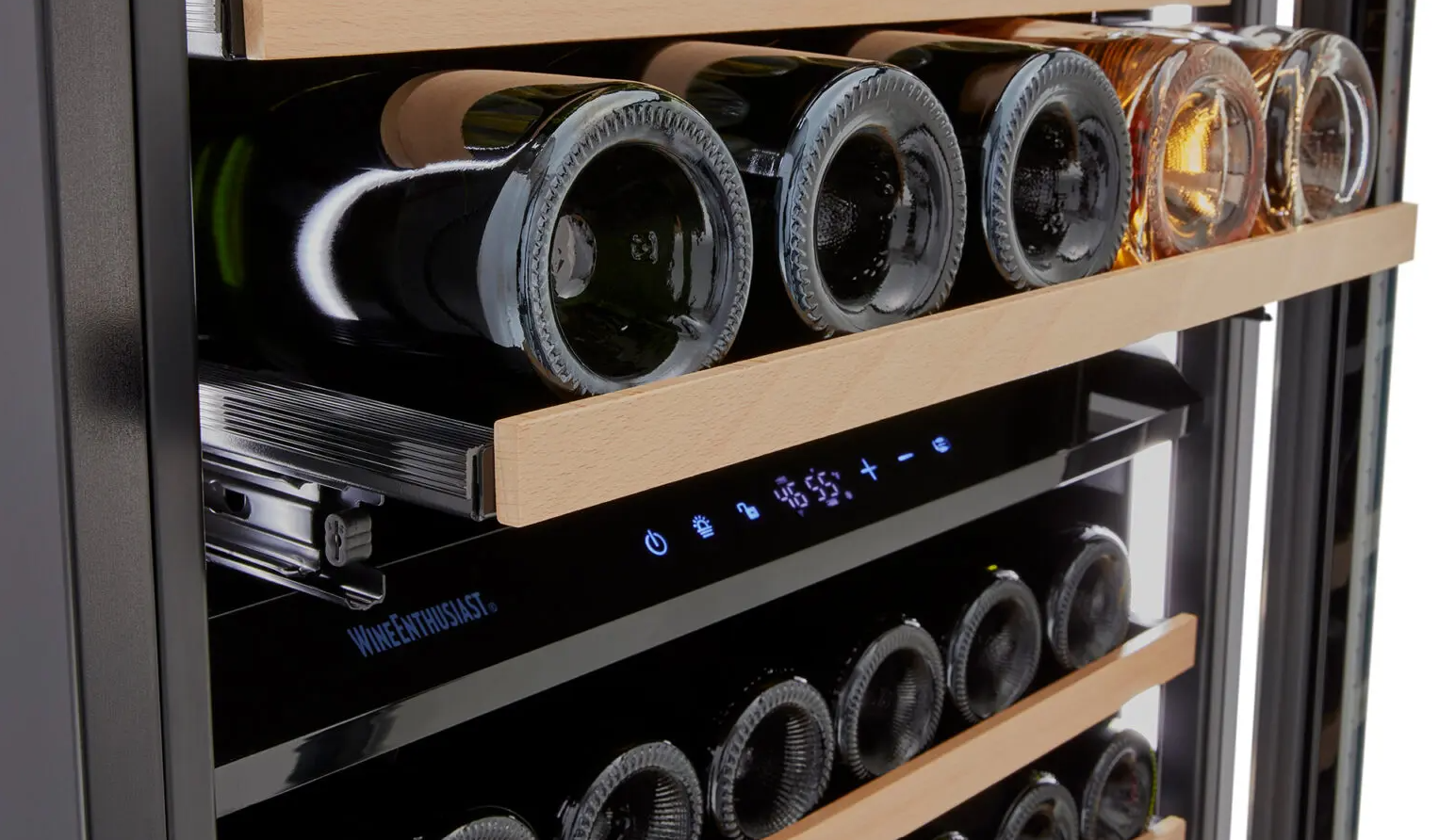 Bottles of wine shelved on a rack of a Wine Enthusiast Dual Zone Wine Fridge